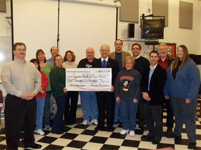 Councilman Bob Weiner presents grant to Friends of Concord HS Band to purchase music composition computers for band